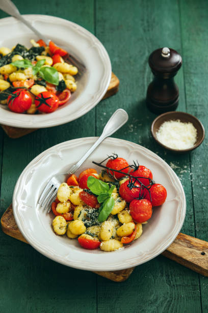 istock Gnocchi with creamy tomato and spinach sauce 1154425384