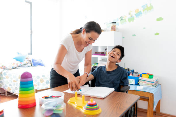 istock Mother playing with son with Cerebral Palsy 1154426648