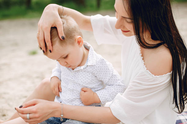 istock Mother with son playing in a summer park 1154426819