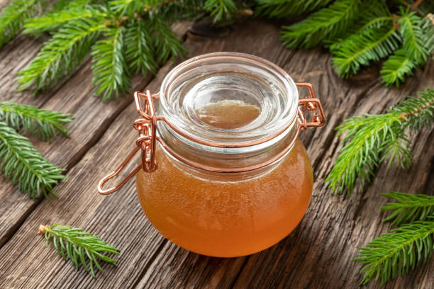 istock Homemade herbal syrup against cough made from young spruce tips 1154427067