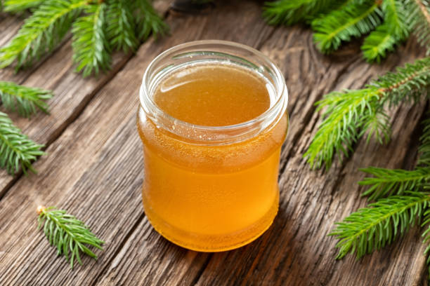 istock Homemade herbal syrup against cough made from young spruce tips 1154427070