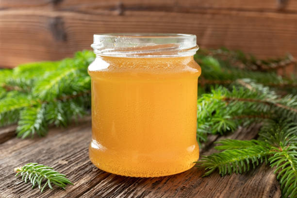 istock Homemade herbal syrup against cough made from young spruce tips 1154427080