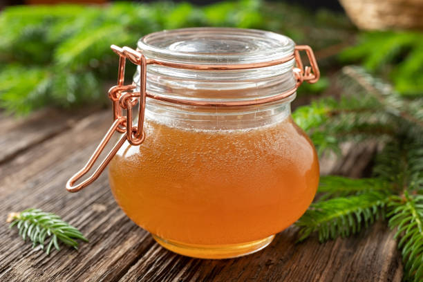 istock Homemade herbal syrup against cough made from young spruce tips 1154427082