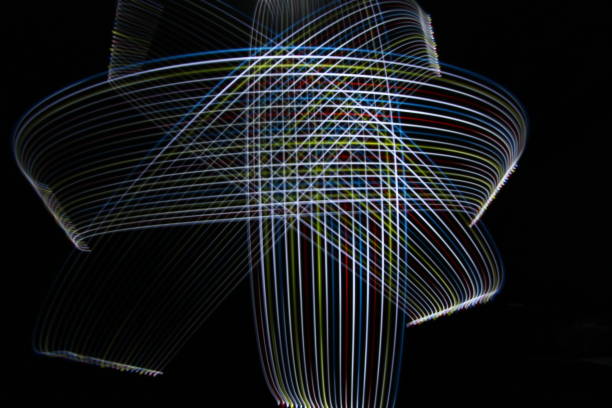 istock Abstract Rainbow LED Light moving on long exposure shot in the dark. 1154427731
