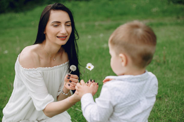 istock Mother with son playing in a summer park 1154427922