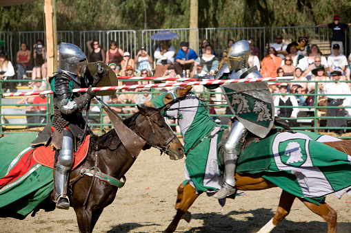 Irwindale, USA - April 26, 2008: A pair of knights joust in the tournament at the Renaissance Pleasure Faire on April 26, 2008 in Irwindale, CA.  The Renaissance Pleasure Faire is the oldest such festival in the country.