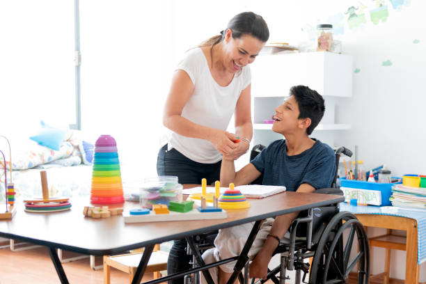istock Mother playing with son with Cerebral Palsy 1154429797
