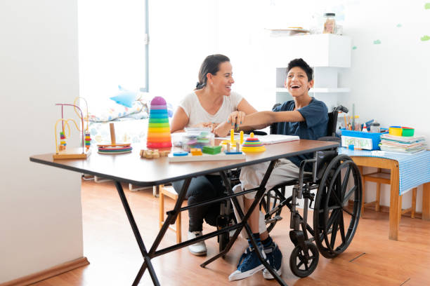 istock Mother playing with son with Cerebral Palsy 1154430407