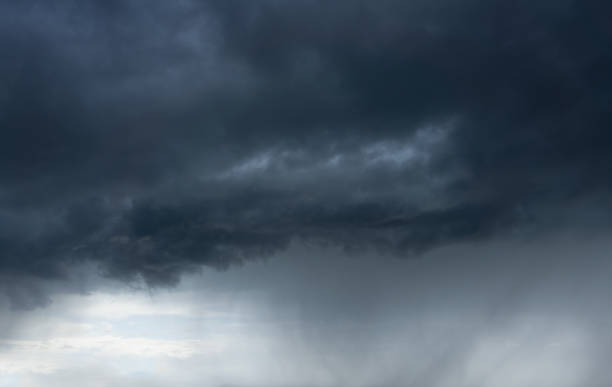 istock dark cloudscape with stormy clouds and rain 1154432227