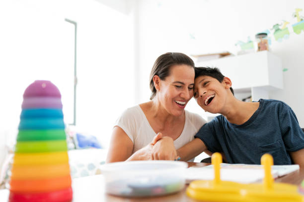 istock Mother playing with son with Cerebral Palsy 1154432265
