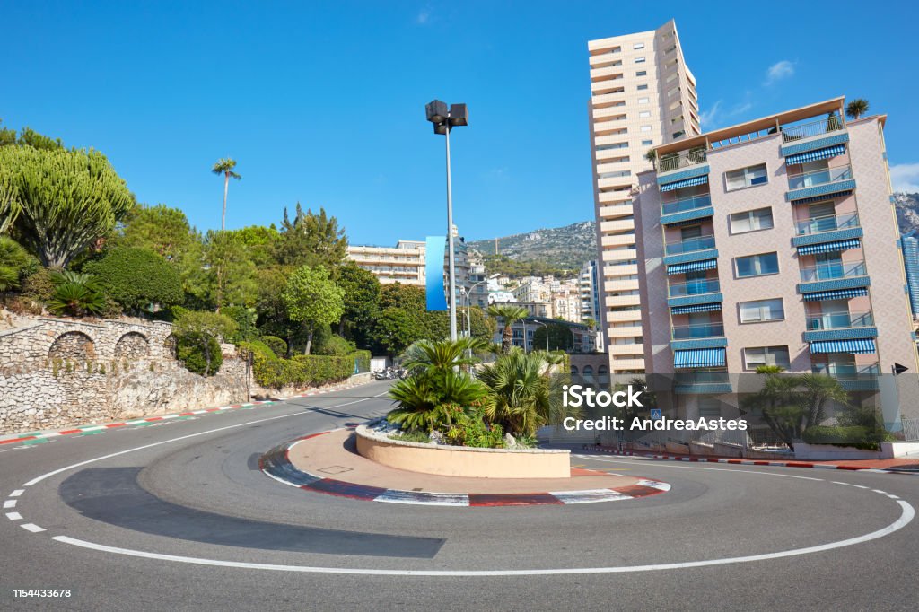 Monte Carlo street curve with formula one red and white signs in a sunny summer day in Monte Carlo, Monaco Monaco Stock Photo