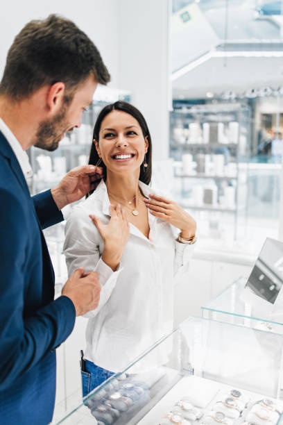 istock Attractive middle age couple in jewelry store 1154434603