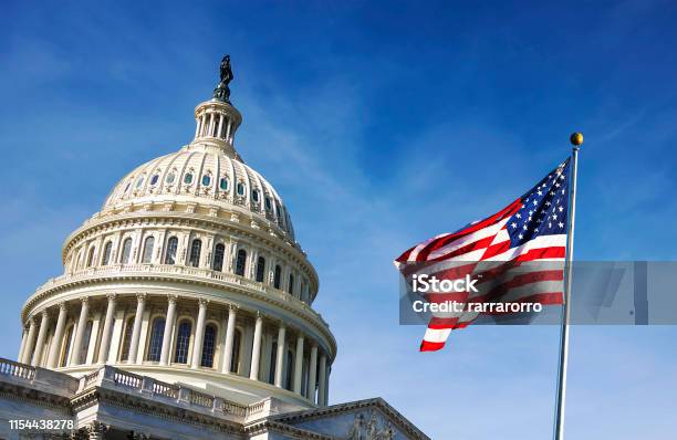 American Flag Waving With The Capitol Hill Stock Photo - Download Image Now - USA, Government, American Culture