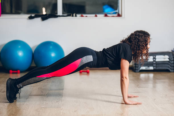 istock Push-ups in the gym 1154439901