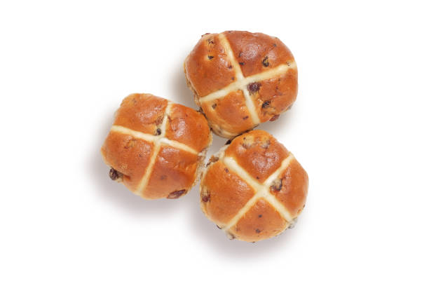 Three hot cross buns shot from above, isolated on white with clipping path