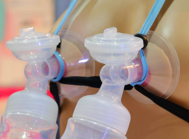 istock Automatic breast pump, mothers breasts milk 1154441661