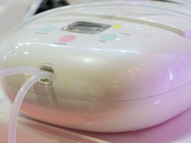 istock Breast pump equipment with milk for baby 1154443995