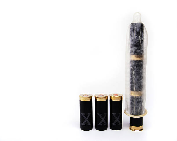 istock Shotgun Cartridges part covered by condom 115444512