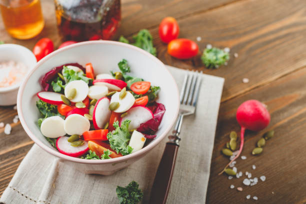 istock Salad with cherry tomatoes, radsh and mozzarella, lettuce mix 1154445738
