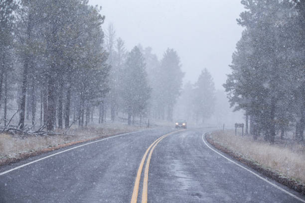 istock car on road in snow 1154445795