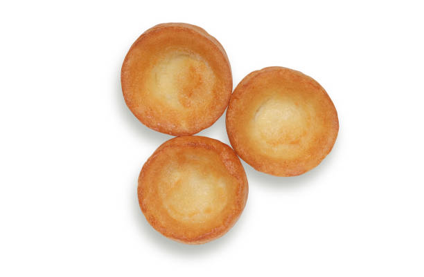 istock Three Yorkshire puddings shot from overhead, isolated on white background with clipping path 1154447802