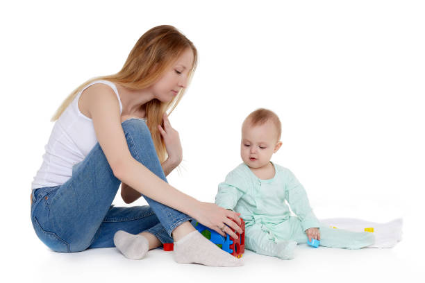 istock Mother play with small baby. 1154447933