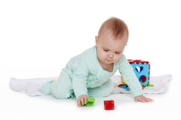 istock Little baby with educational toys. 1154448008