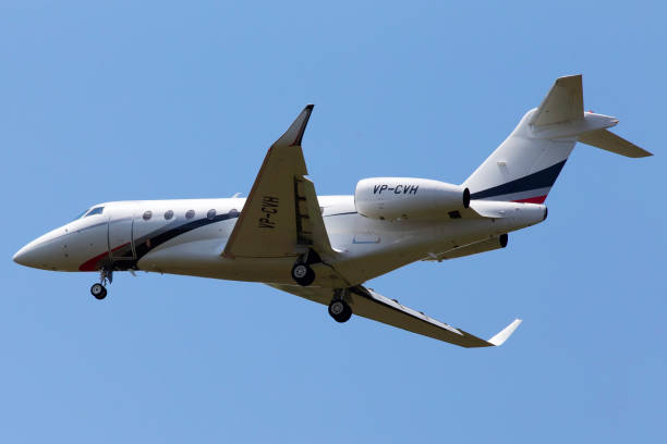 VP-CVH Gulfstream G280 aircraft on the blue sky background stock photo