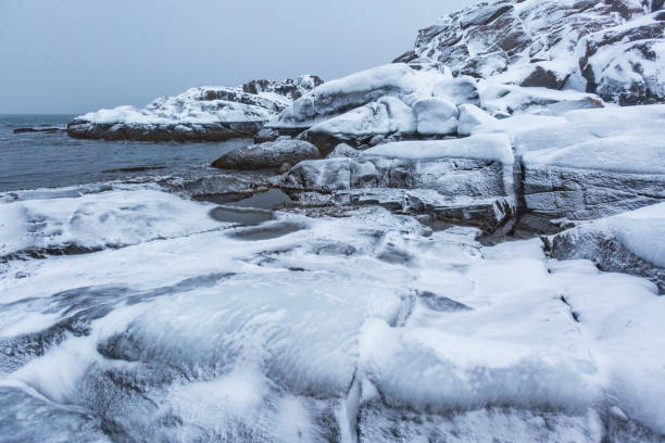 istock Barents Sea shore. Kola Peninsula winter landscape 1154448275