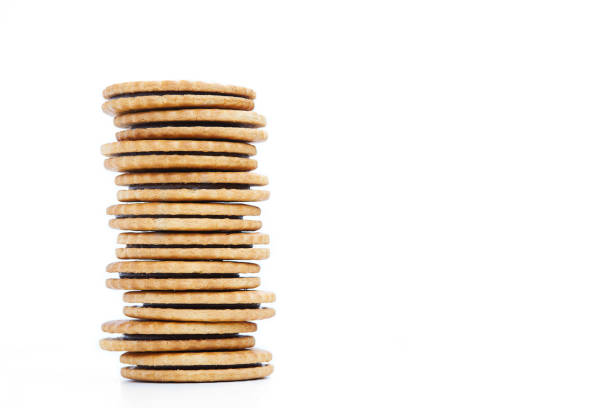 istock Heap of cookies with chocolate stuffing on white background 1154448927