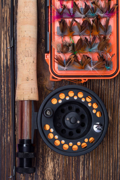 istock fishing kit set on burnt wooden background 1154449066