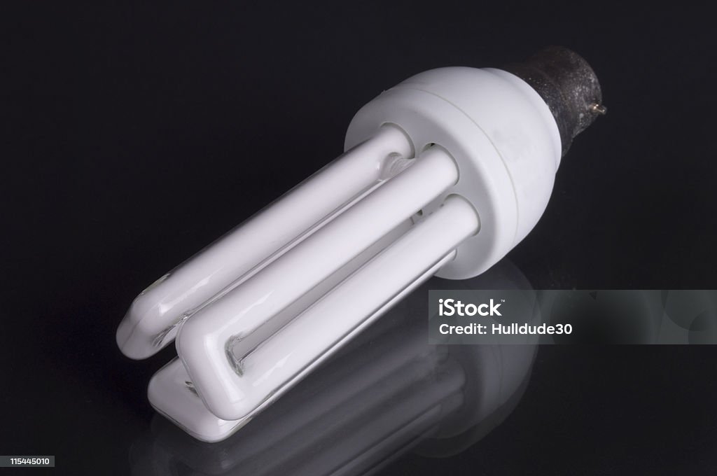 Energy saving Lighbulb on black background  Appliance Stock Photo