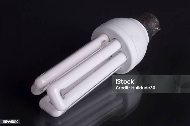 Energy Saving Lighbulb On Black Background Stock Photo - Download Image Now - Appliance, Black Background, Color Image