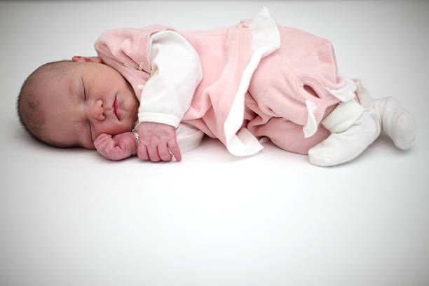 Newborn Girl Sleeping  baby bracelet stock pictures, royalty-free photos & images