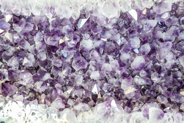 istock Amethyst druse, amethyst crystals close up view, precious 1154451700