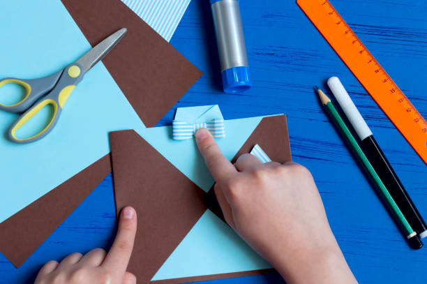 istock Child makes greeting card for Father's Day. Step 10 1154451719