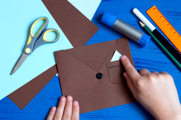 istock Child makes greeting card for Father's Day. Step 8 1154451729