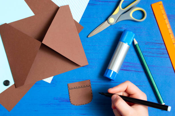 istock Child makes greeting card for Father's Day. Step 6 1154451731
