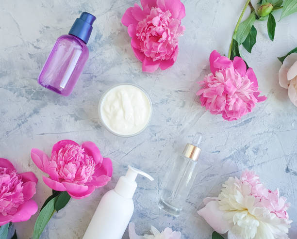 istock cream cosmetic flower peony on gray concrete 1154451938