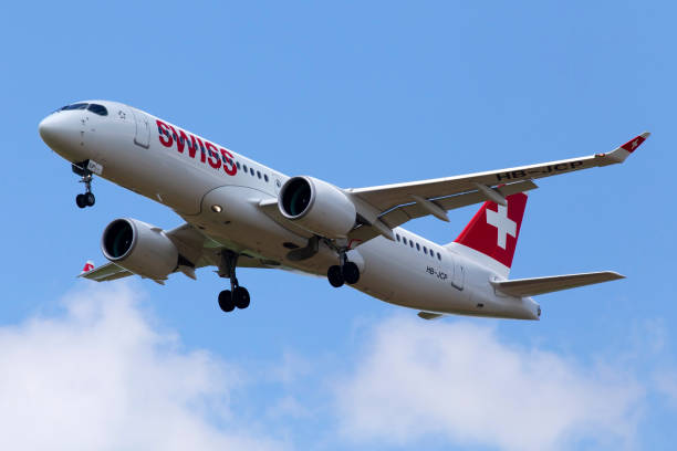 HB-JCP Swiss Airbus A220-300 aircraft on the cloudy sky background stock photo
