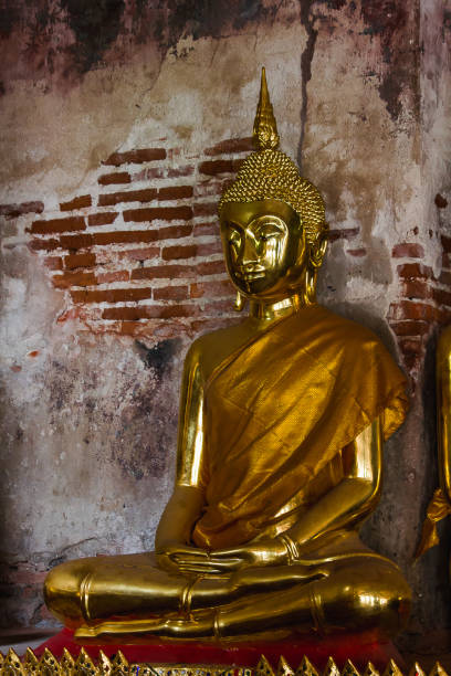 istock Golden Buddha statue in Thai temple 1154457704