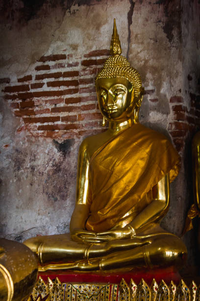 istock Golden Buddha statue in Thai temple 1154457715