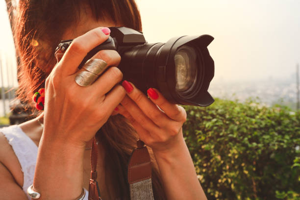 istock asian photographer taking photos with slr camera 1154458490