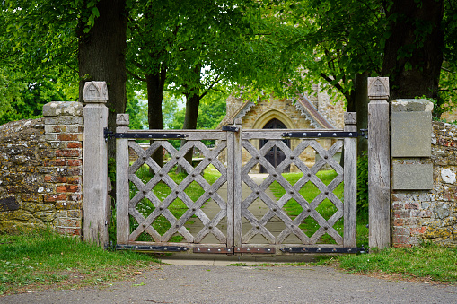 Ornate wooden gate in the countryside