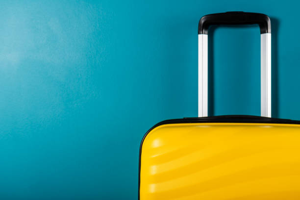 istock Bright and stylish cabin size suitcase as holiday concept 1154464794