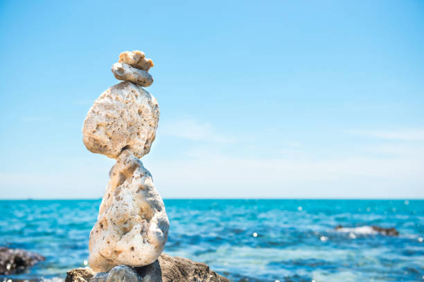 istock Zen stones balance at sea background 1154468621
