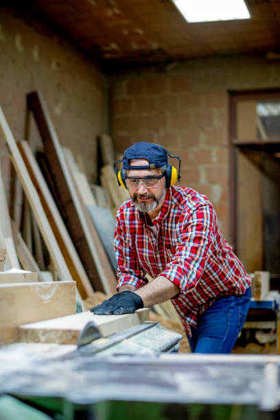 istock Craftsman working at Electric Saw 1154470989