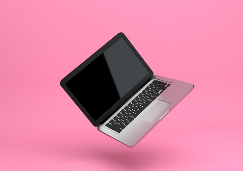 Laptop notebook mock up with pastel pink color background. Float and levitate laptop. Technology gadget for hipster background concept. Minimal creative concept High resolution 3D Render Illustration