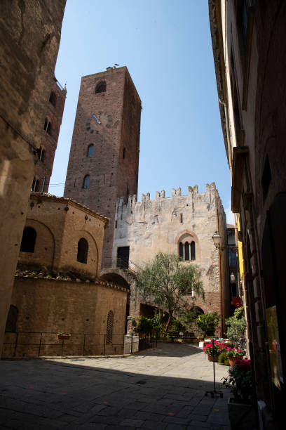 baptistry, palazzo vecchio and civic tower. albenga. - italy albenga liguria tower imagens e fotografias de stock