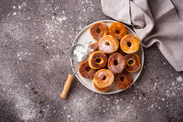 istock Homemade donuts with sugar powder 1154475448